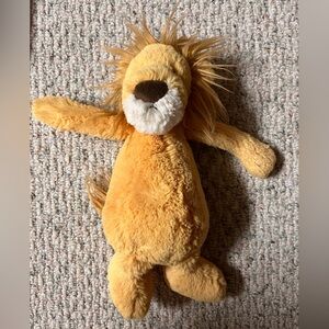 Jellycat Bashful Lion stuffed animal. Golden yellow plush fur caramel mane